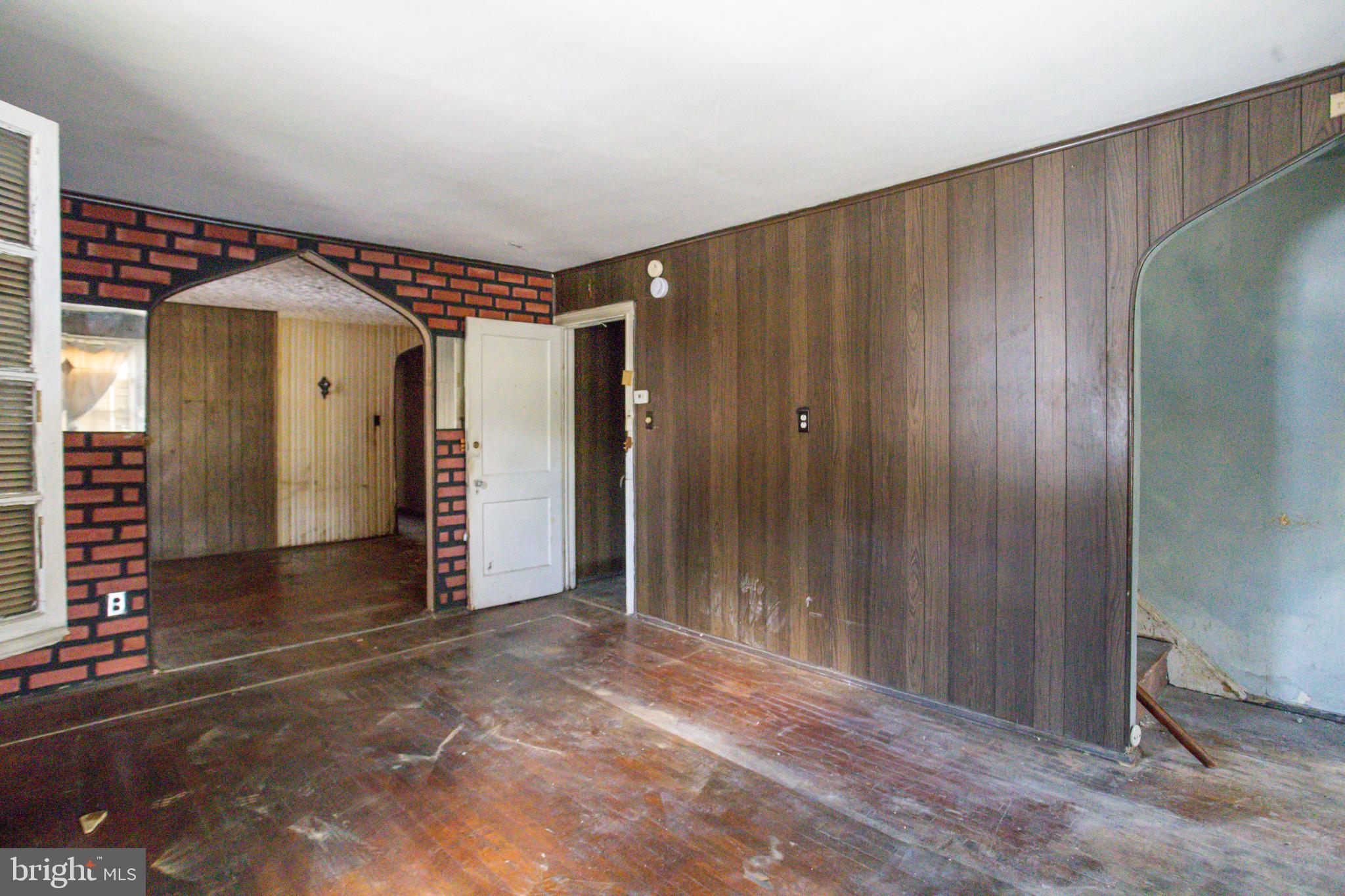4209 Chatham Road Baltimore, MD 21207 - Photo 14 of 37 a view of entryway with wooden walls
