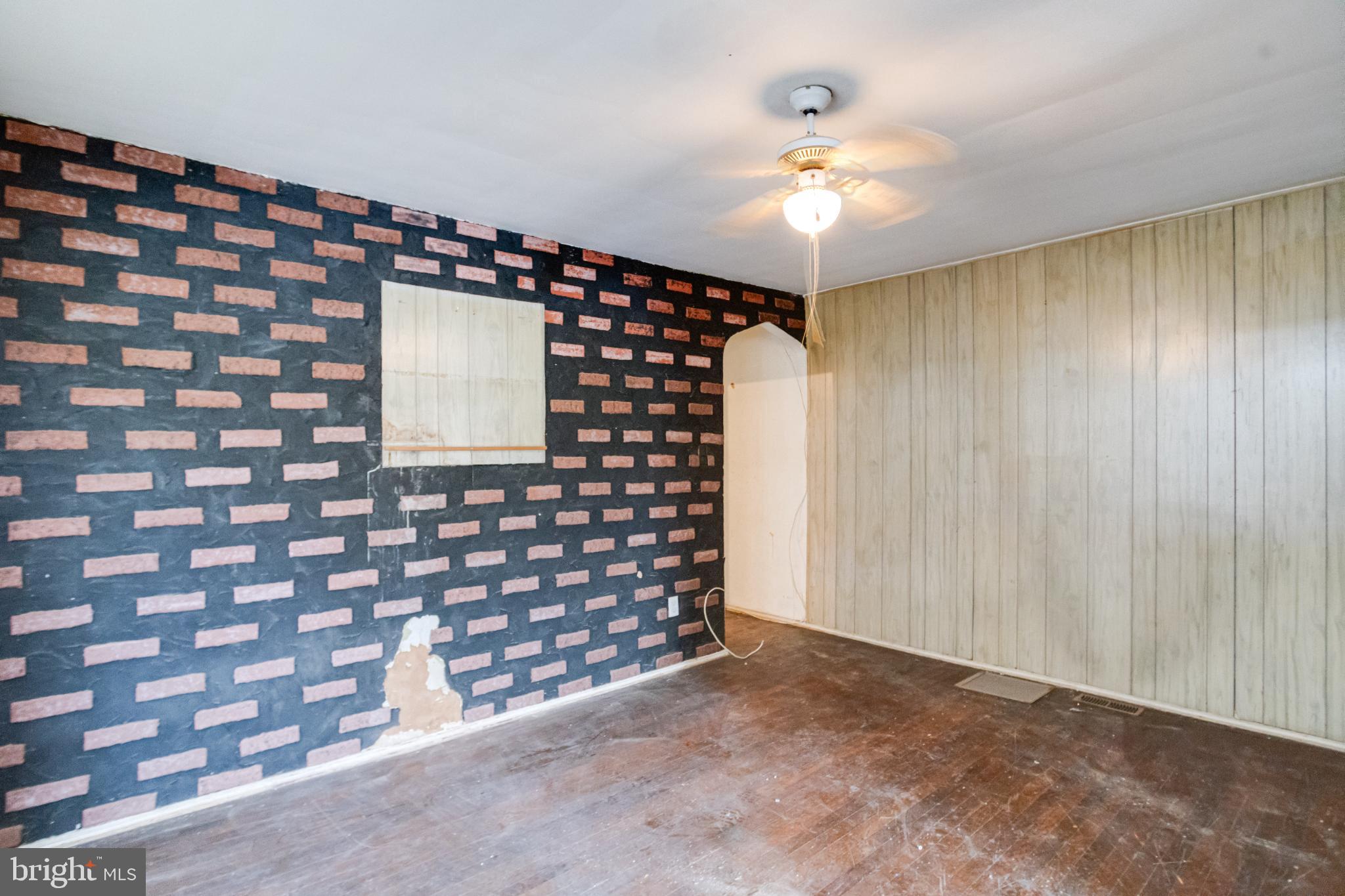 4209 Chatham Road Baltimore, MD 21207 - Photo 15 of 37 a very nice looking room with a large window and chandelier fan