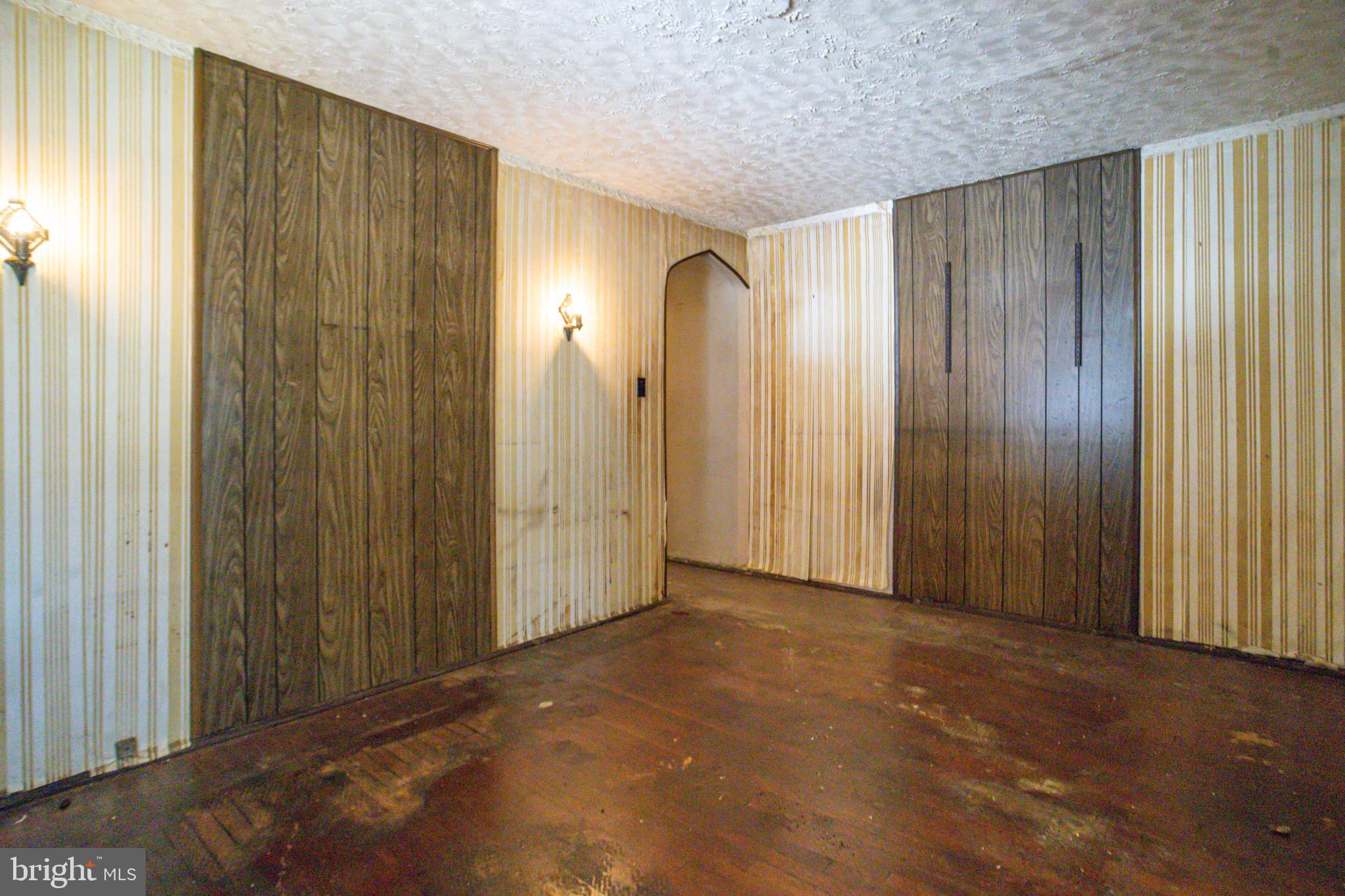 4209 Chatham Road Baltimore, MD 21207 - Photo 19 of 37 a view of an empty room with wooden walls