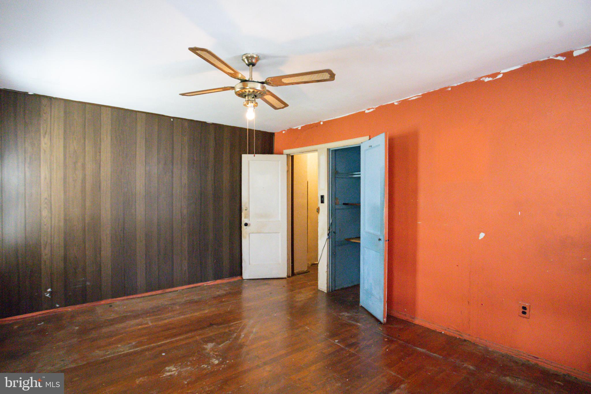 4209 Chatham Road Baltimore, MD 21207 - Photo 23 of 37 a view of a livingroom with a ceiling fan and entryway