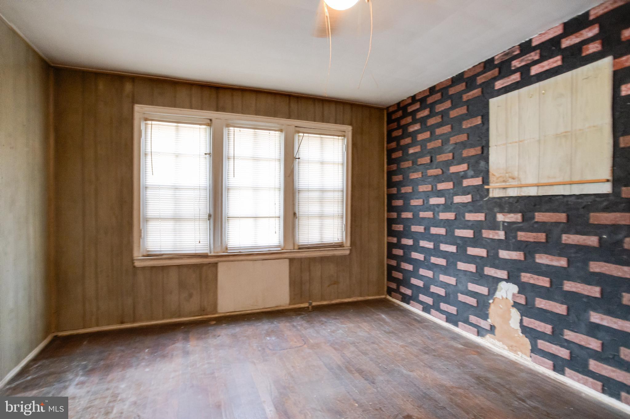 4209 Chatham Road Baltimore, MD 21207 - Photo 8 of 37 a view of an empty room with a window