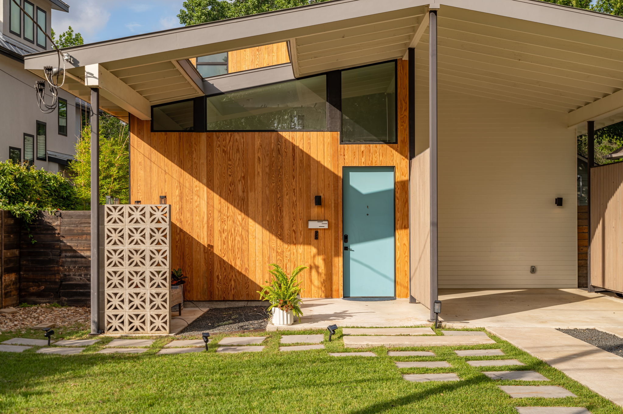 1811 Collier Street Austin, TX 78704 - Photo 3 of 40 Modern architectural facade featuring natural wood paneling and an angled roofline