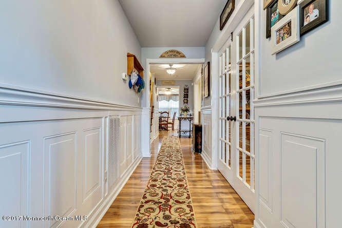 48 Peachstone Road Howell, NJ 07731 - Photo 3 of 24 a view of a hallway with wooden floor and staircase