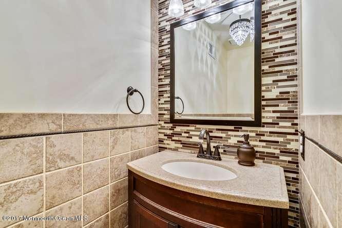 48 Peachstone Road Howell, NJ 07731 - Photo 5 of 24 a bathroom with a sink and a mirror