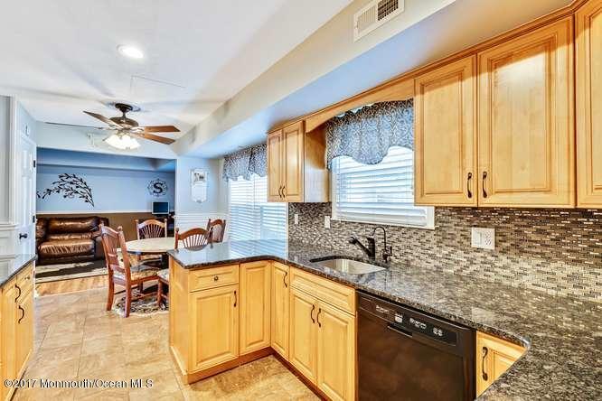 48 Peachstone Road Howell, NJ 07731 - Photo 10 of 24 a kitchen with a sink cabinets and window