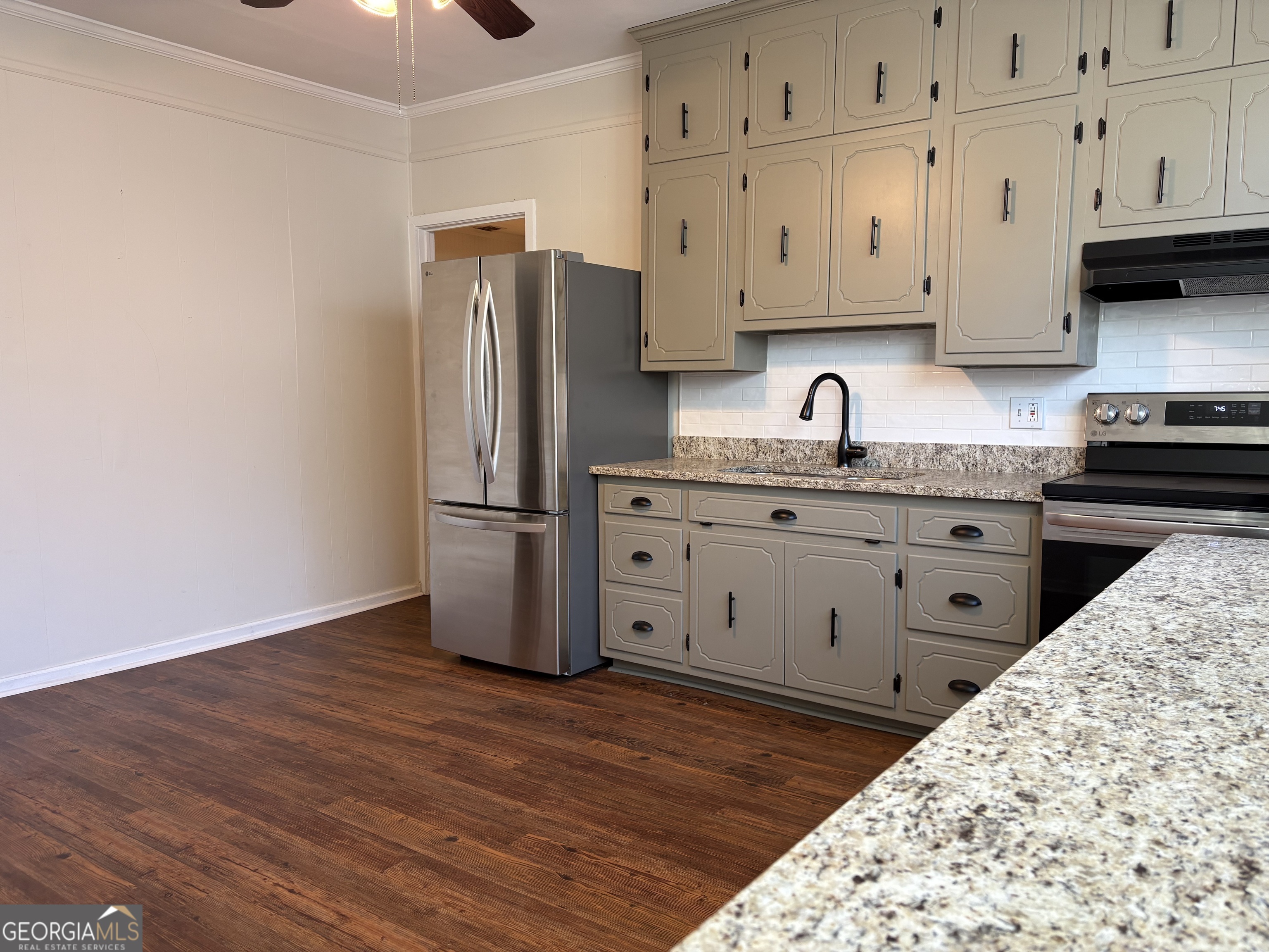 119 S Street Northwest Thomaston, GA 30286 - Photo 14 of 31 a kitchen with stainless steel appliances granite countertop a refrigerator and a stove top oven