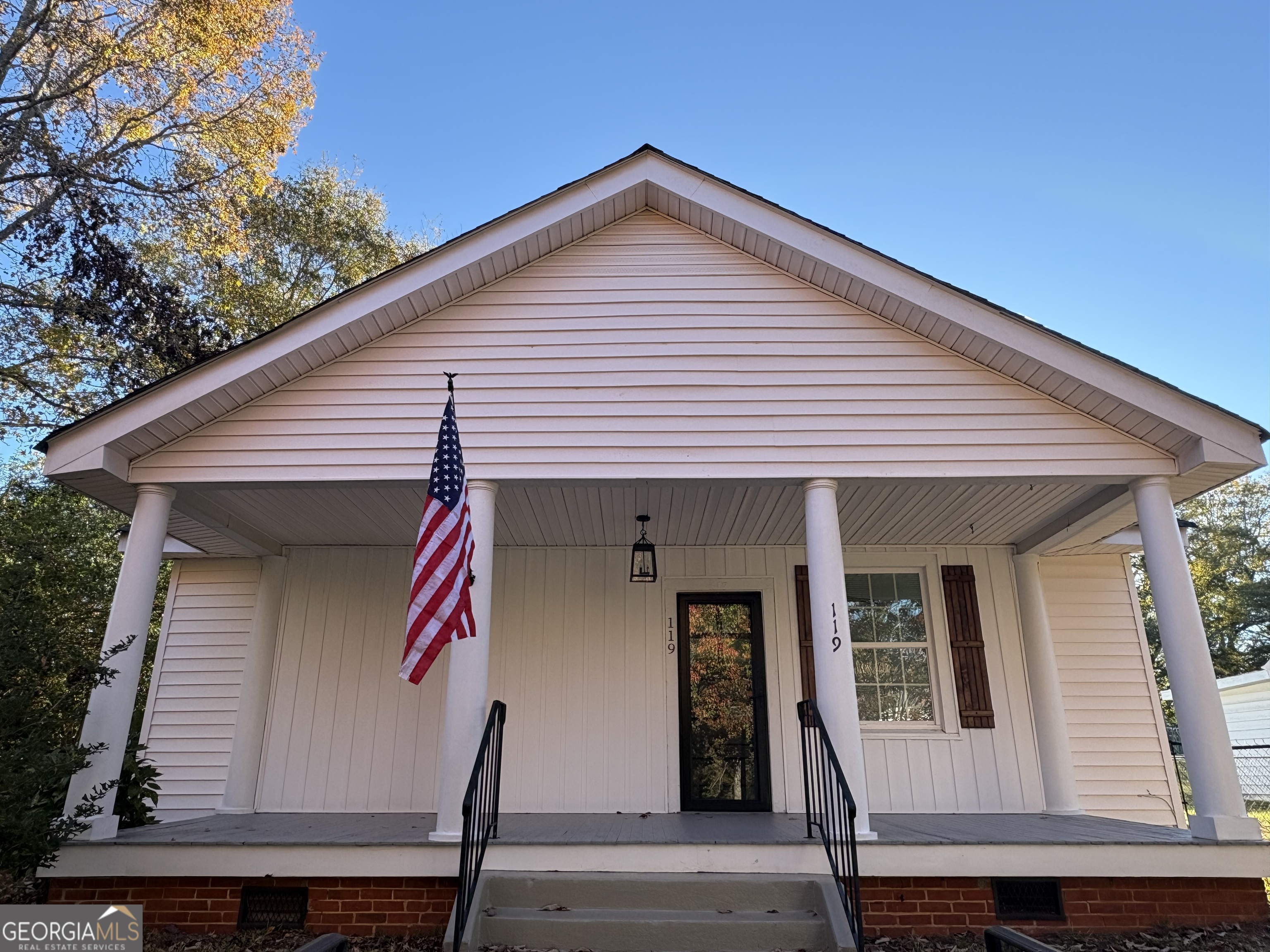 119 S Street Northwest Thomaston, GA 30286 - Photo 2 of 31 a front view of a house with wooden stairs