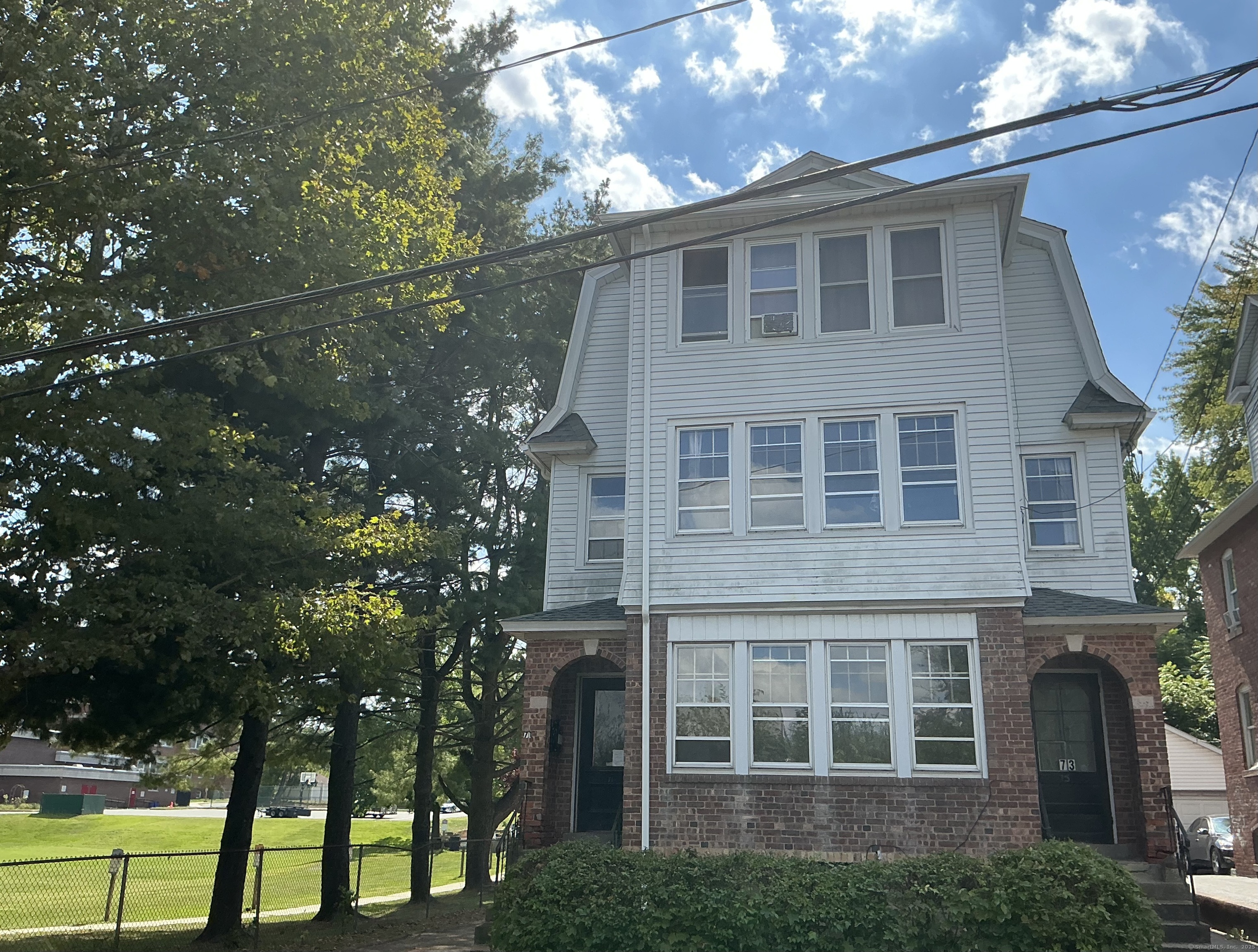 73 Stack Street Middletown, CT 06457 - Photo 1 of 18 a front view of a house with a yard