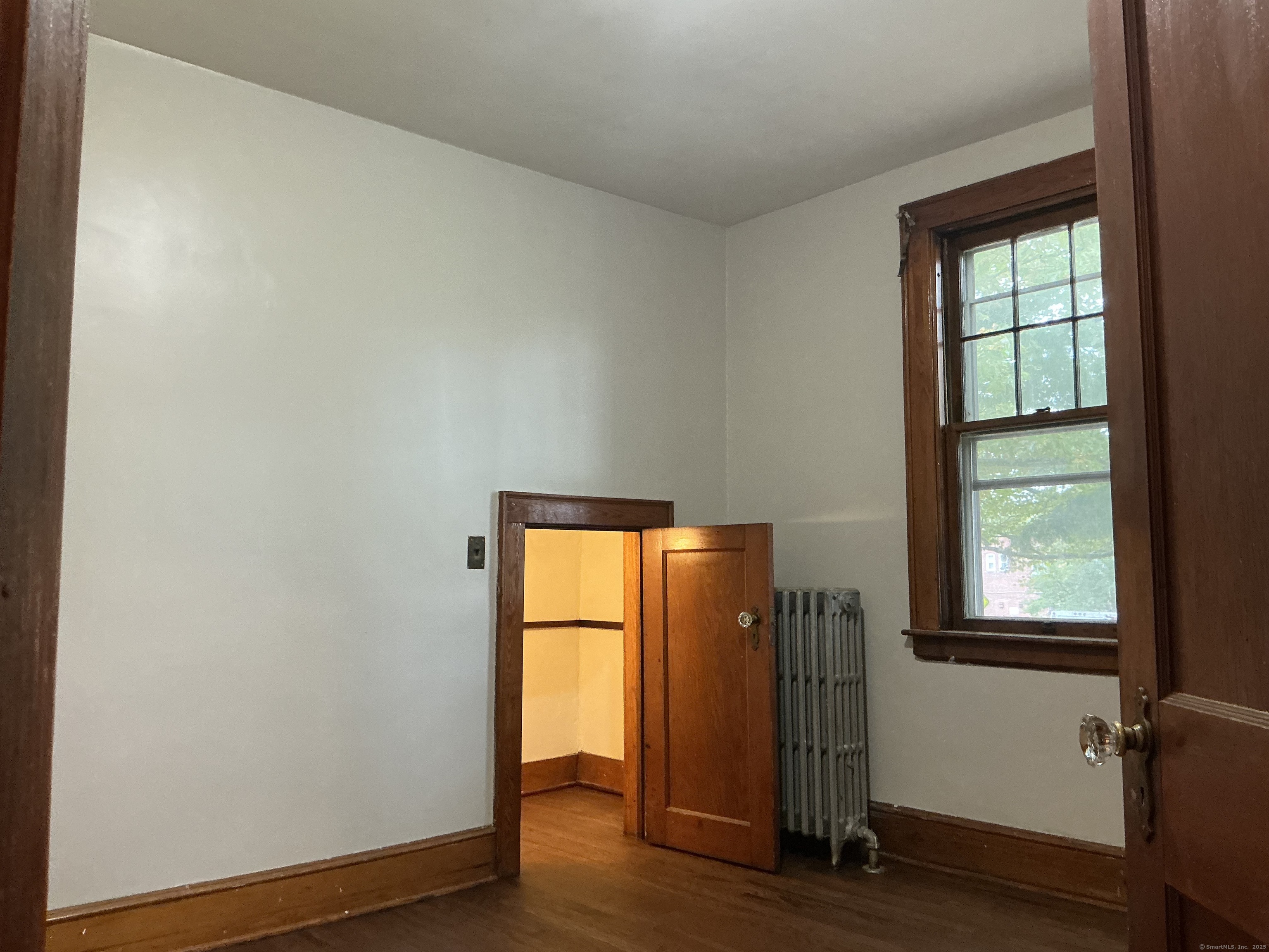 73 Stack Street Middletown, CT 06457 - Photo 14 of 18 an empty room with wooden floor and a window