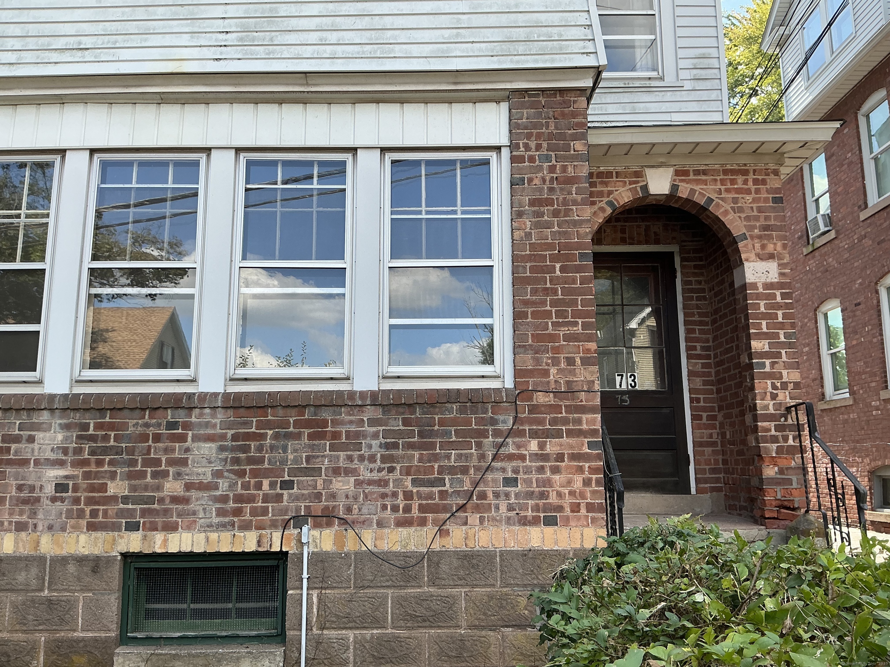 73 Stack Street Middletown, CT 06457 - Photo 2 of 18 a front view of a house with plants