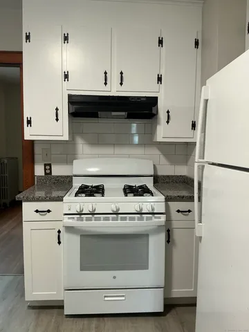 a kitchen with a stove and a microwave