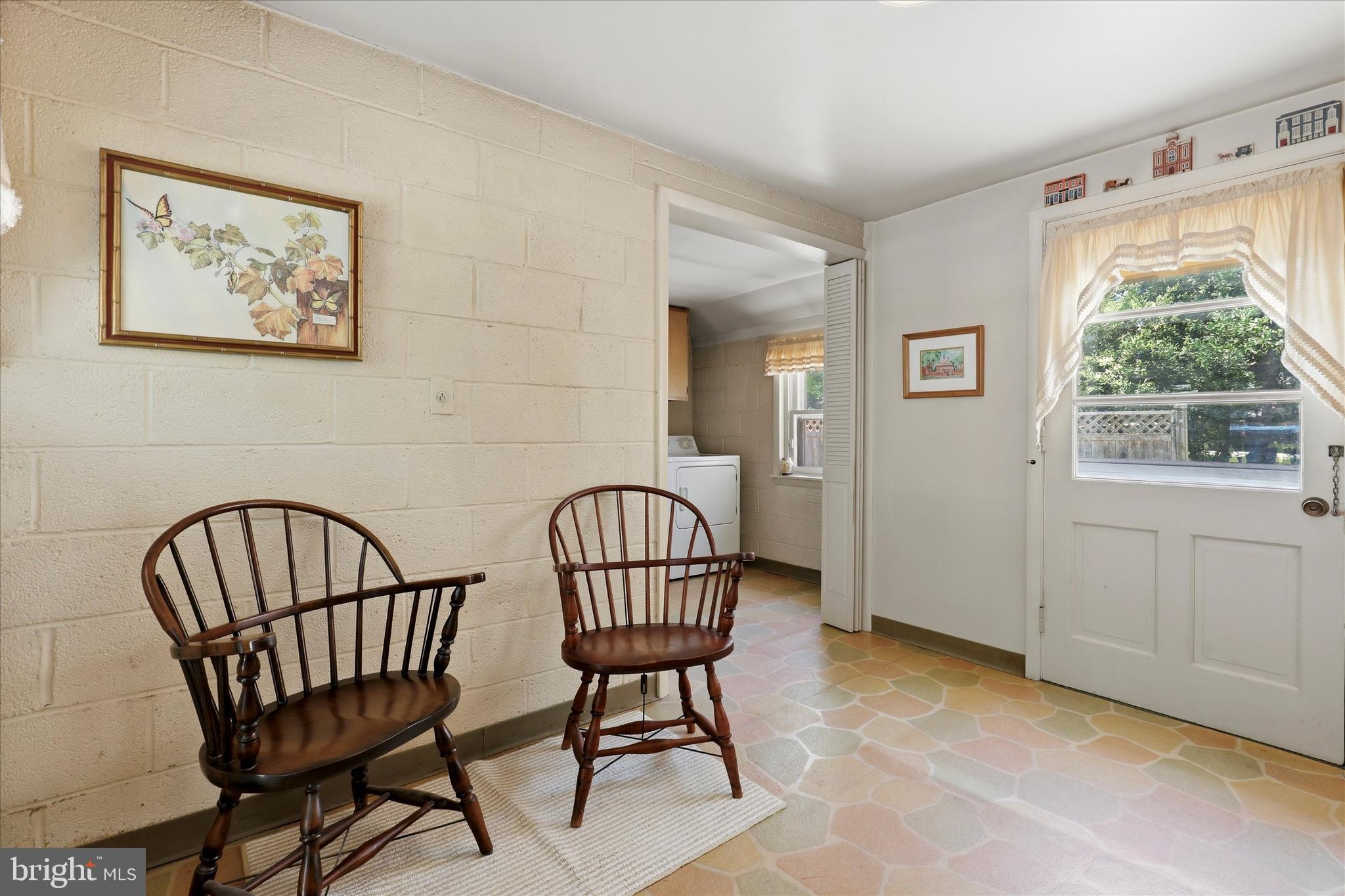 412 Newbold Road Jenkintown, PA 19046 - Photo 12 of 17 a view of a hallway with wooden floor and a dining room