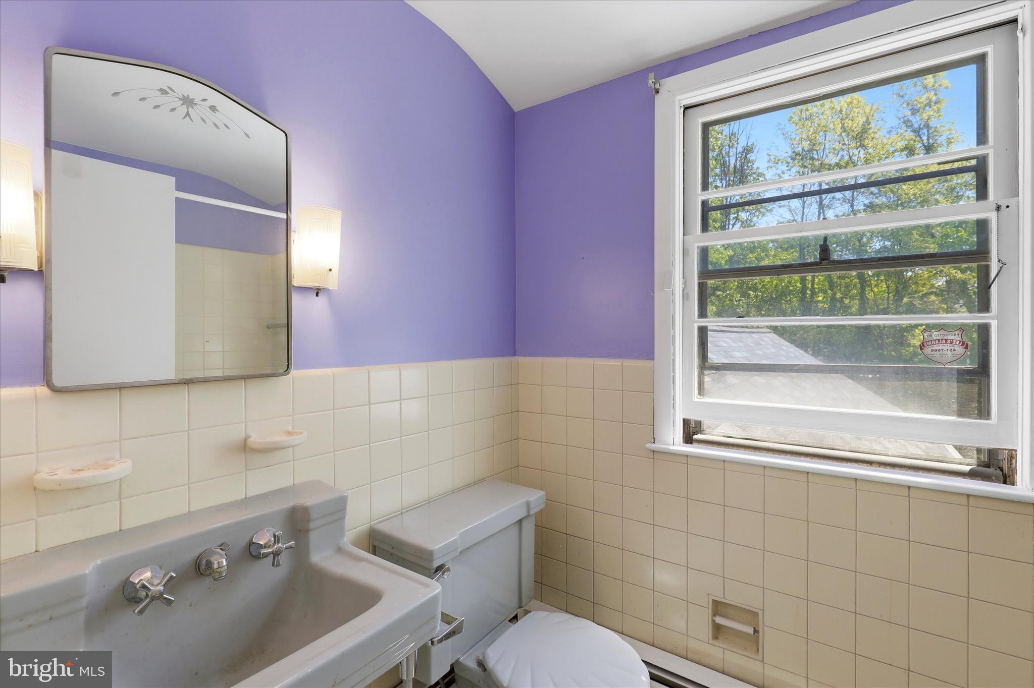 412 Newbold Road Jenkintown, PA 19046 - Photo 15 of 17 a bathroom with a sink mirror and a toilet