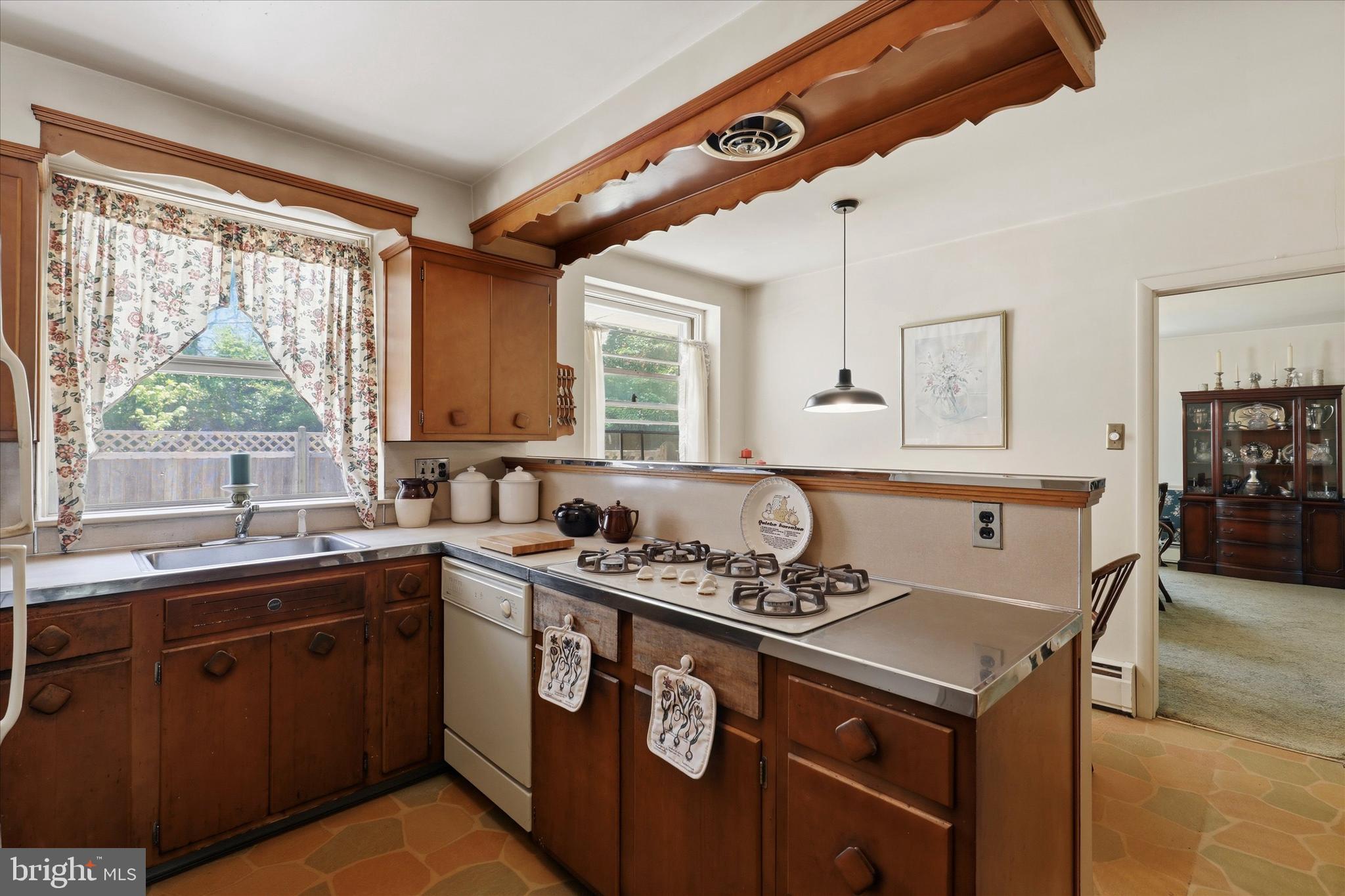 412 Newbold Road Jenkintown, PA 19046 - Photo 7 of 17 a kitchen with a sink stove and cabinets
