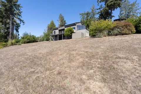 a view of a backyard of the house