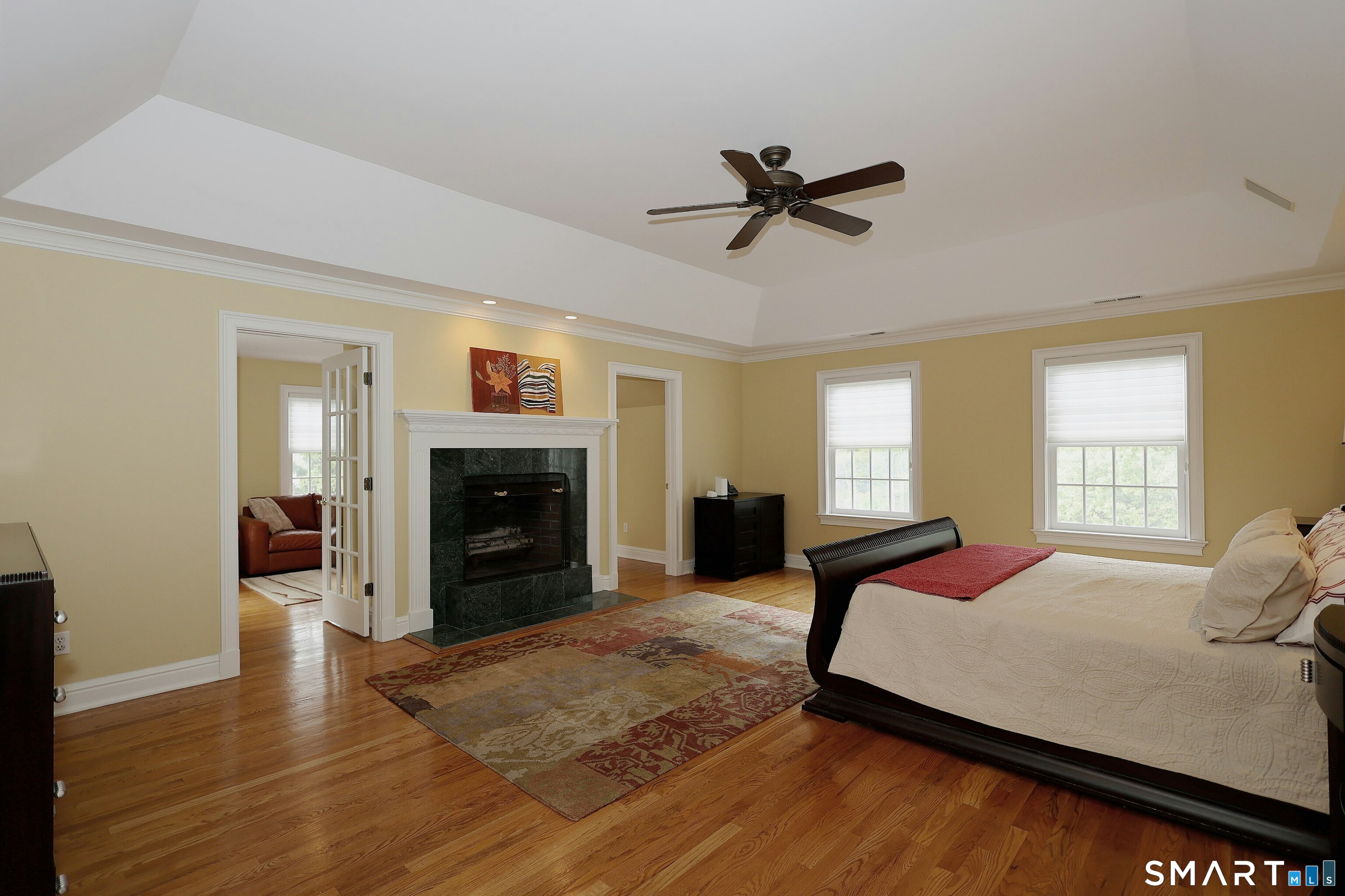 30 Whipstick Road Ridgefield, CT 06877 - Photo 25 of 40 a bed room with a bed and a fireplace