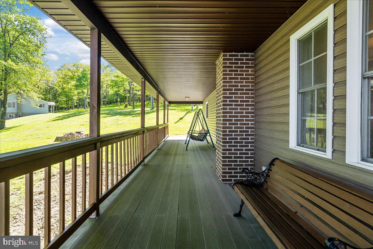 663 Bear Woods Road Mount Storm, WV 26739 - Photo 48 of 73 Serene porch with lush green views.
