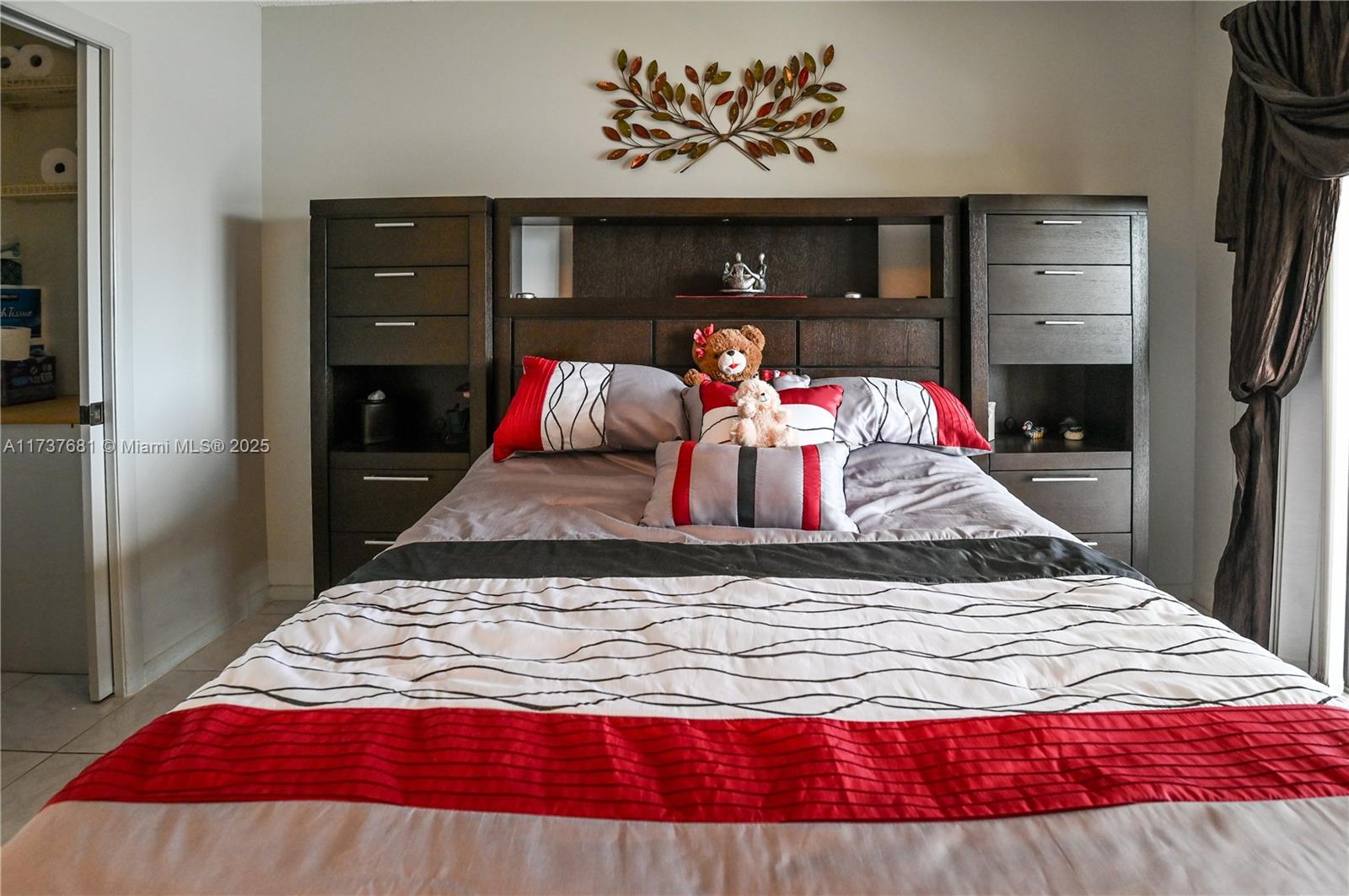 4110 Oakridge V, Unit 4110 Deerfield Beach, FL 33442 - Photo 27 of 63 a bedroom with a bed and a couch