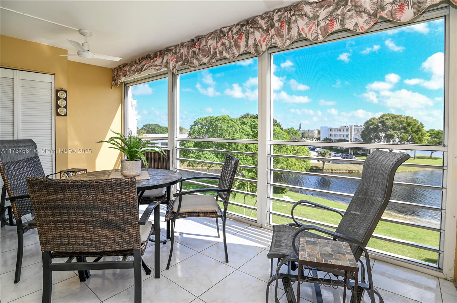 4110 Oakridge V, Unit 4110 Deerfield Beach, FL 33442 - Photo 35 of 63 a view of an chairs and table in the patio