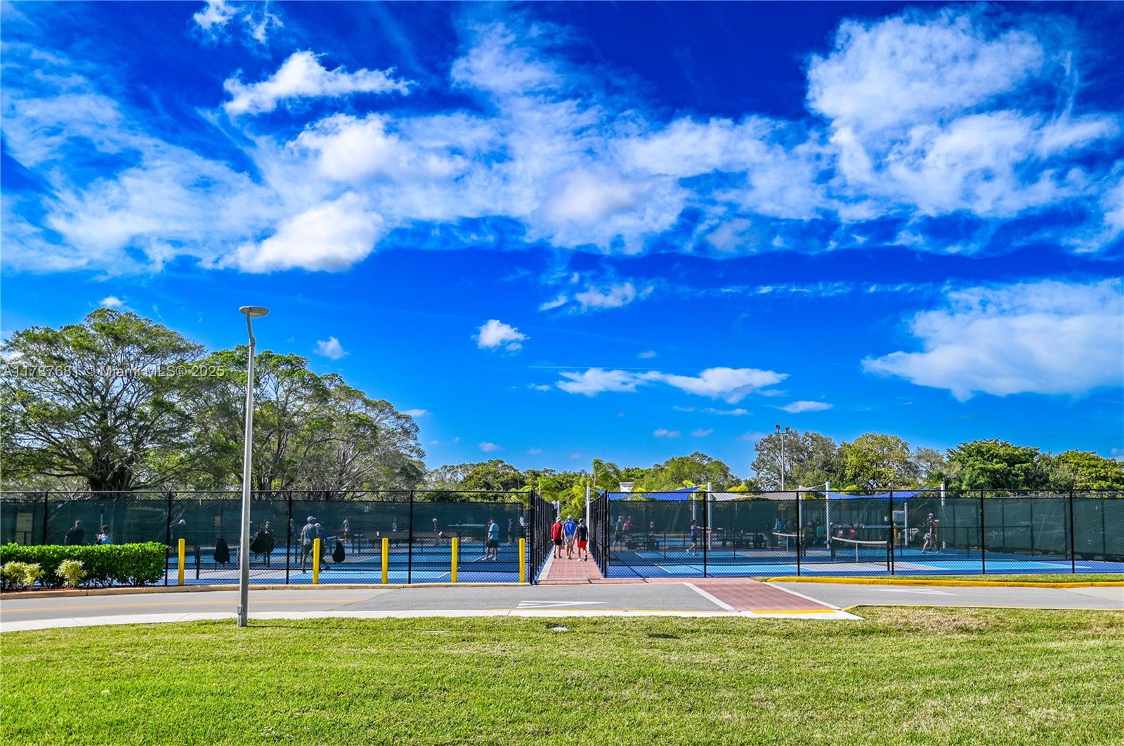 4110 Oakridge V, Unit 4110 Deerfield Beach, FL 33442 - Photo 58 of 63 a view of a playground with basketball court
