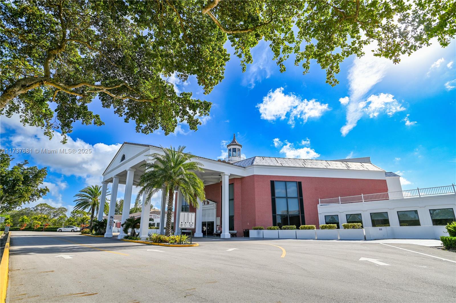 4110 Oakridge V, Unit 4110 Deerfield Beach, FL 33442 - Photo 61 of 63 a view of a building with a street
