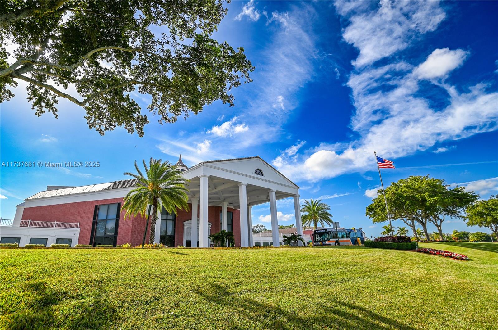 4110 Oakridge V, Unit 4110 Deerfield Beach, FL 33442 - Photo 62 of 63 a view of a building with a big yard and large trees