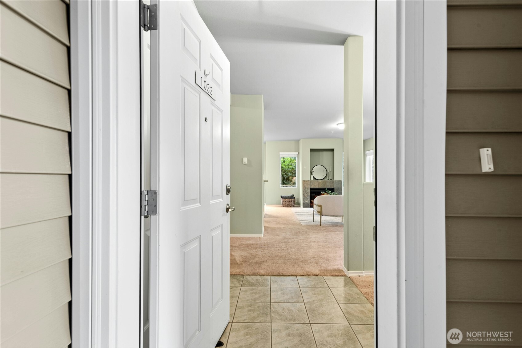 14915 38th Drive Southeast, Unit II1033 Bothell, WA 98012 - Photo 1 of 25 a view of a hallway with wooden floor and a bathroom