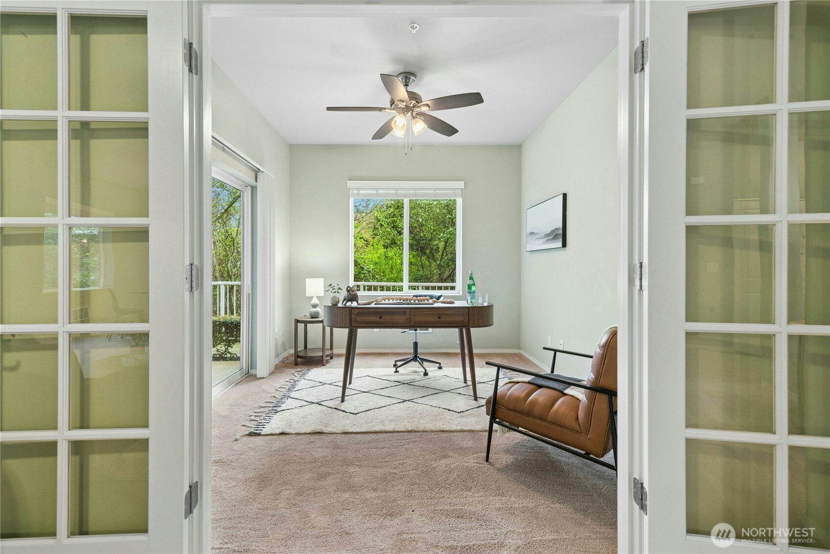 14915 38th Drive Southeast, Unit II1033 Bothell, WA 98012 - Photo 11 of 25 a living room with furniture and a window