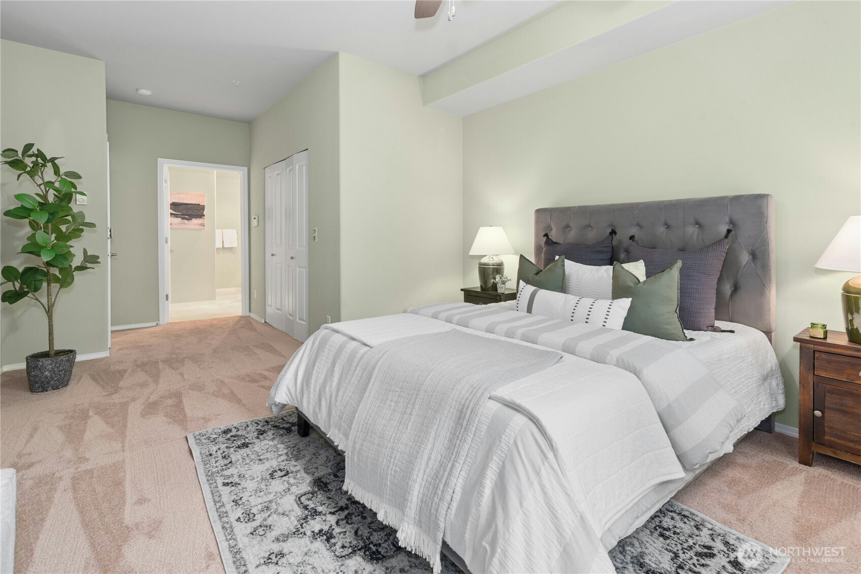 14915 38th Drive Southeast, Unit II1033 Bothell, WA 98012 - Photo 12 of 25 a bedroom with bed and a potted plant