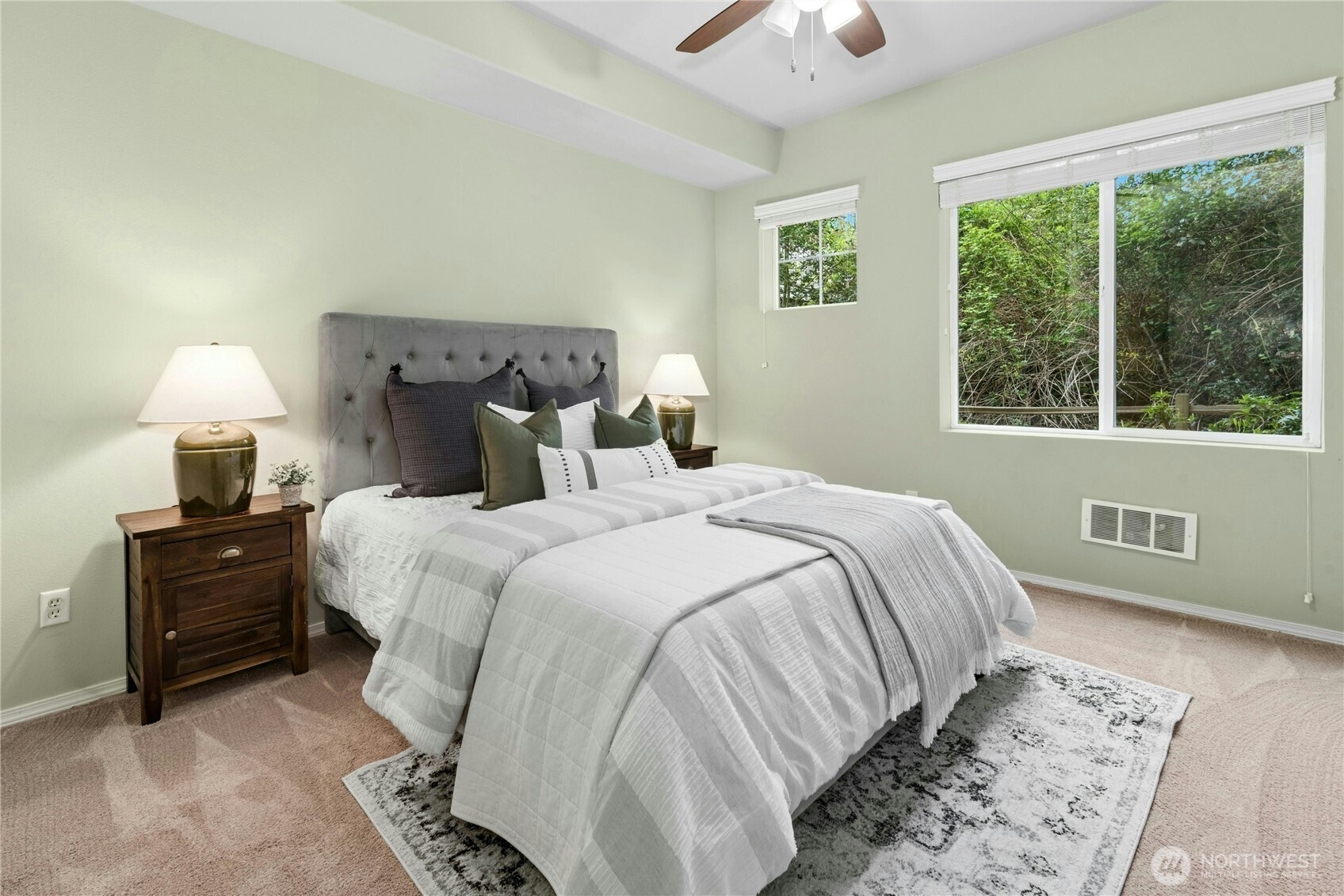 14915 38th Drive Southeast, Unit II1033 Bothell, WA 98012 - Photo 13 of 25 a bedroom with a bed and a lamp on dresser