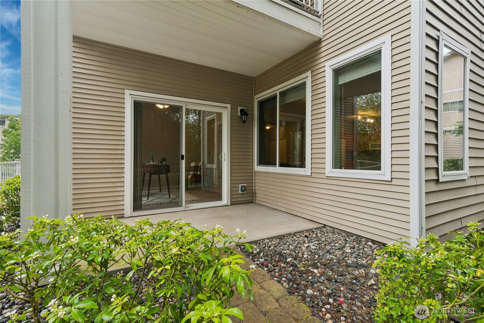 14915 38th Drive Southeast, Unit II1033 Bothell, WA 98012 - Photo 19 of 25 a front view of a house with a garden