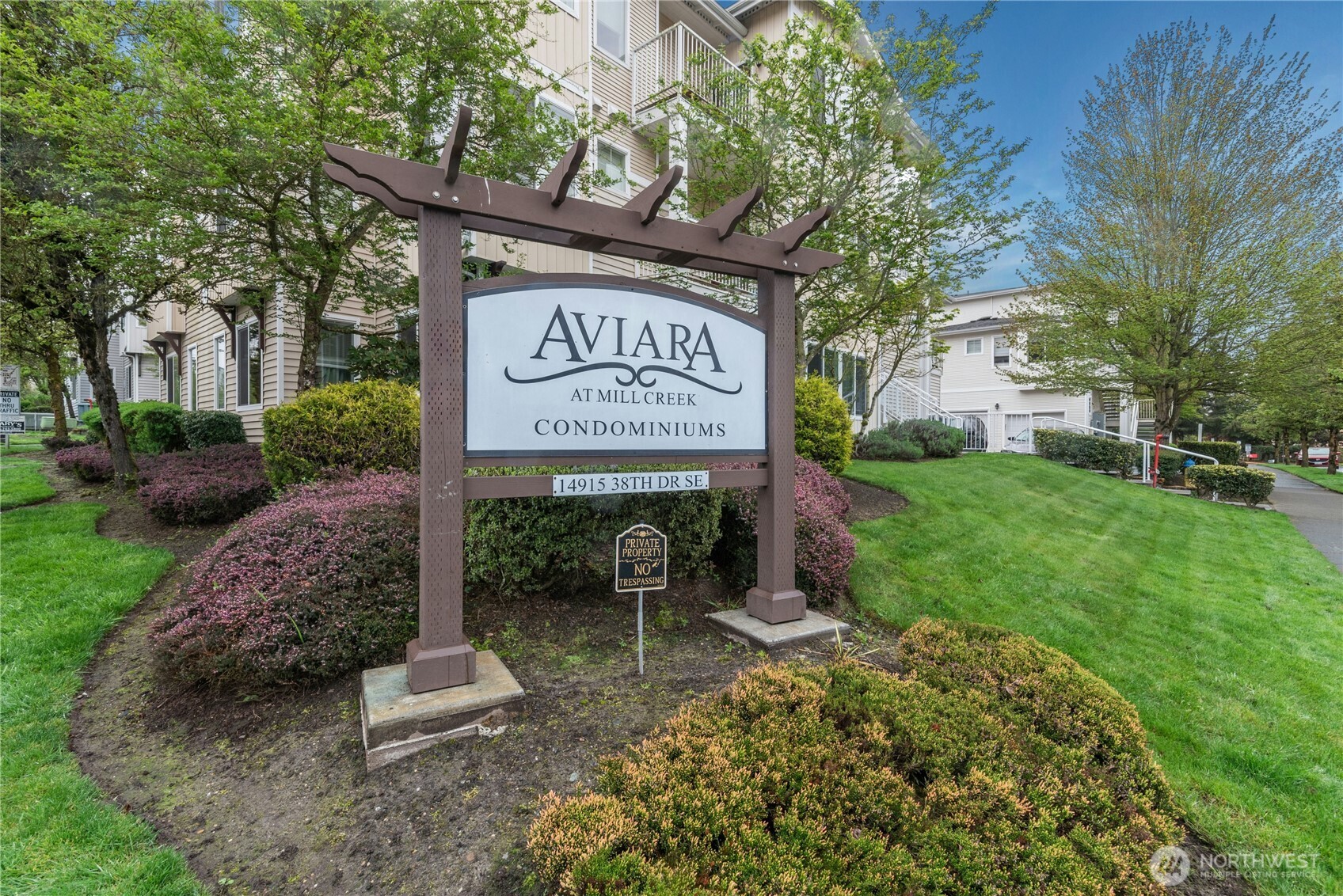 14915 38th Drive Southeast, Unit II1033 Bothell, WA 98012 - Photo 21 of 25 a view of a park that has sign board