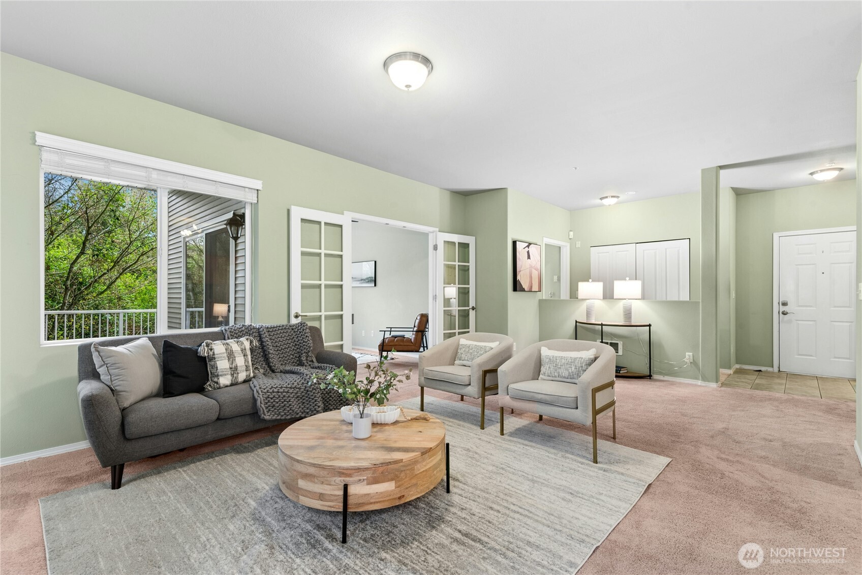 14915 38th Drive Southeast, Unit II1033 Bothell, WA 98012 - Photo 3 of 25 a living room with furniture and a large window