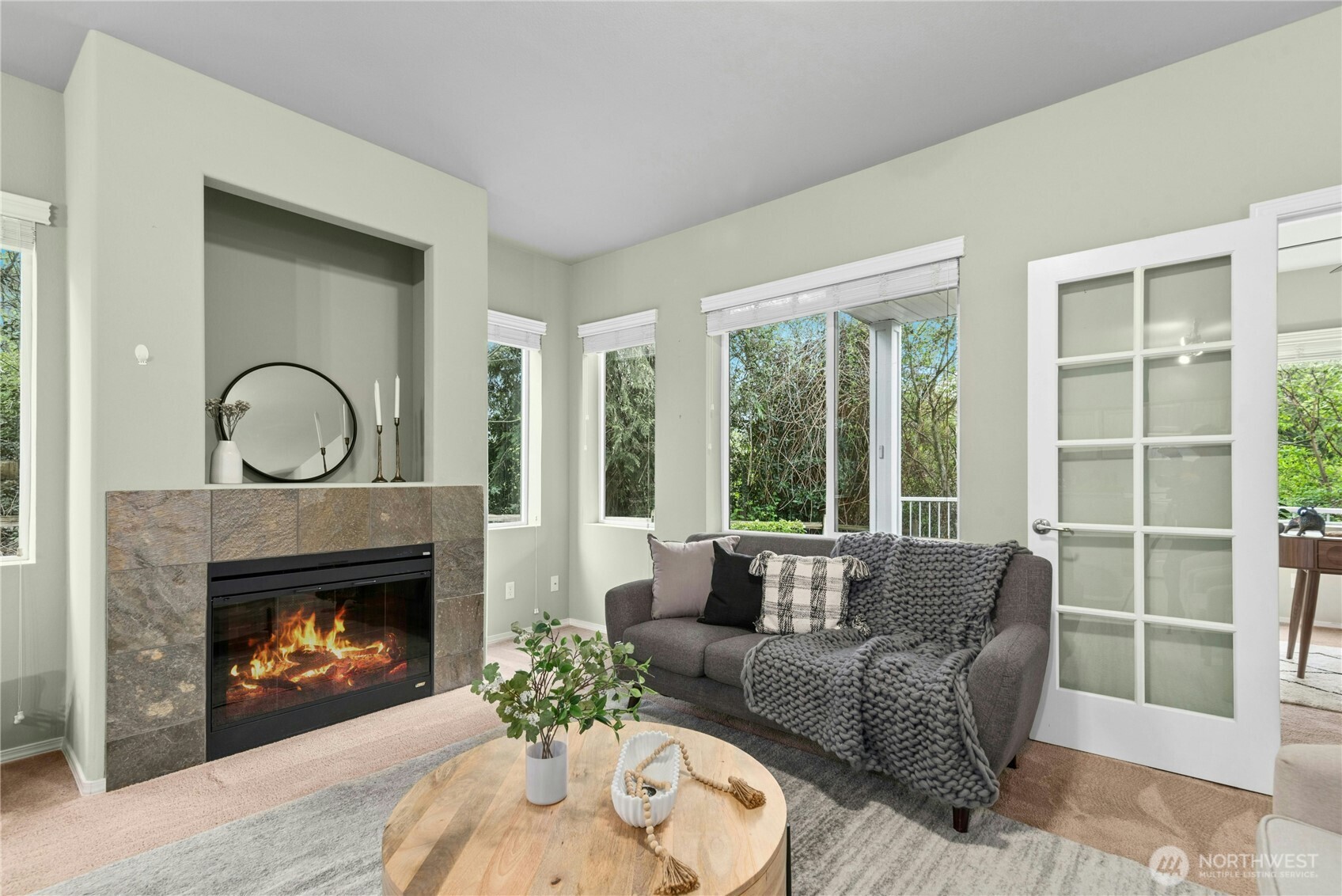 14915 38th Drive Southeast, Unit II1033 Bothell, WA 98012 - Photo 4 of 25 a living room with furniture a window and a fireplace