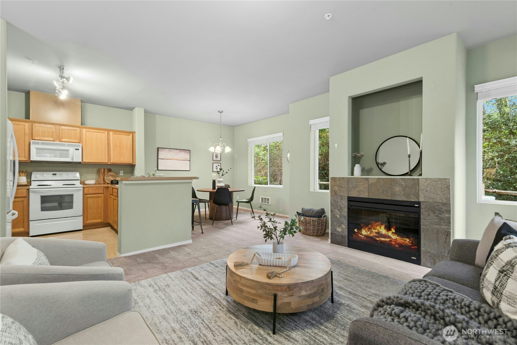 14915 38th Drive Southeast, Unit II1033 Bothell, WA 98012 - Photo 5 of 25 a living room with furniture and a fireplace