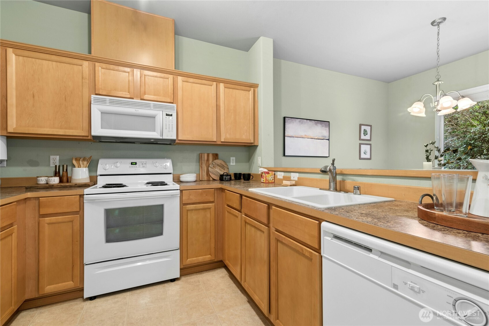 14915 38th Drive Southeast, Unit II1033 Bothell, WA 98012 - Photo 8 of 25 a kitchen with a sink stove and cabinets
