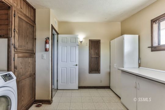541 South Allen Street Ridgecrest, CA 93555 - Photo 29 of 41 a view of a refrigerator in kitchen and furniture