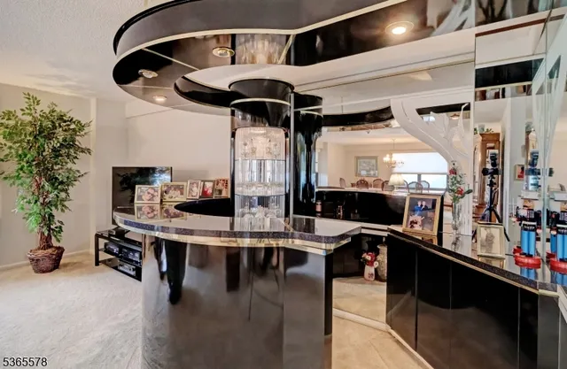 a kitchen with a stove a refrigerator and potted plants