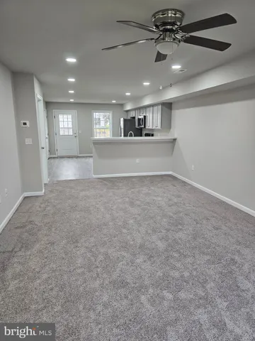 a view of an empty room and window