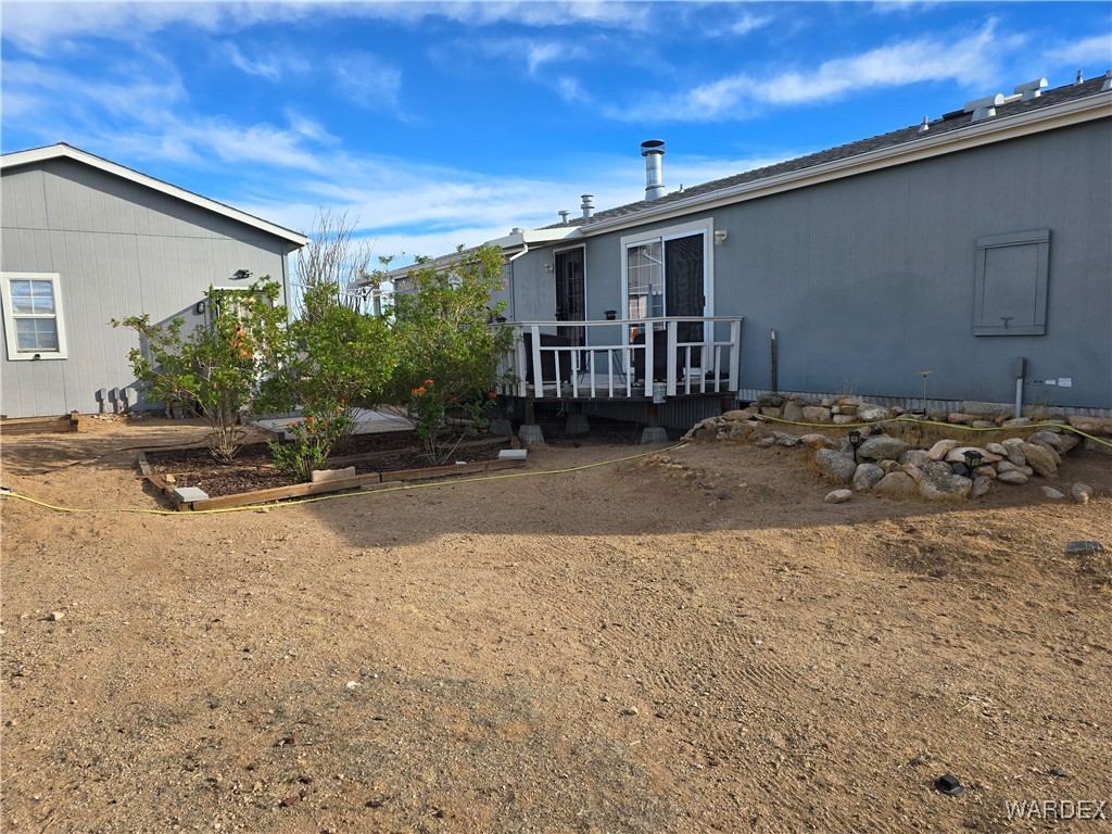 19688 South Diamondback Road Yucca, AZ 86438 - Photo 53 of 66 Back of property featuring a deck