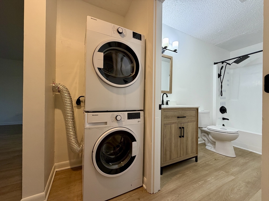 18 Pierce Street, Unit 3B Foxboro, MA 02035 - Photo 8 of 21 a view of a hallway with washer and dryer
