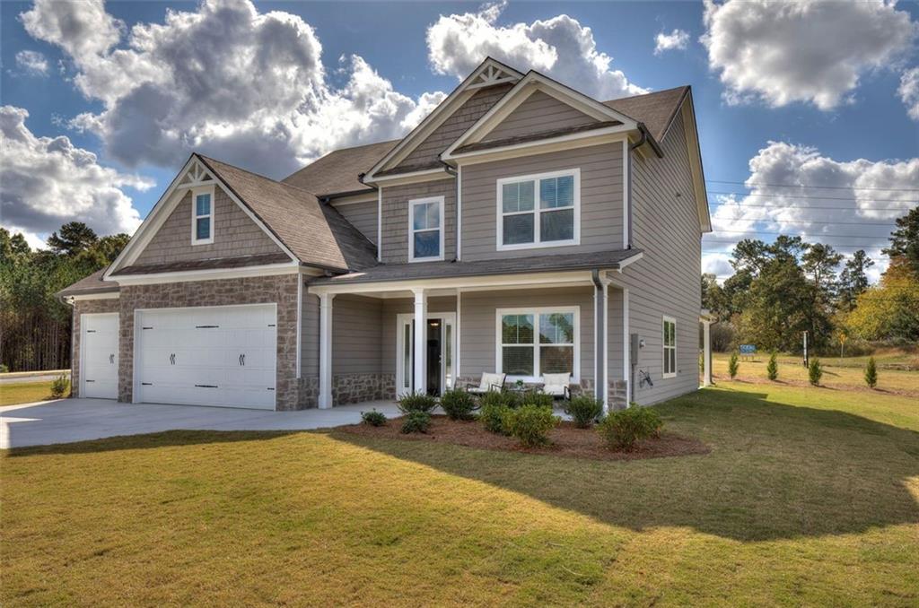 128 Elivia Way Dallas, GA 30132 - Photo 1 of 1 a front view of a house with a yard