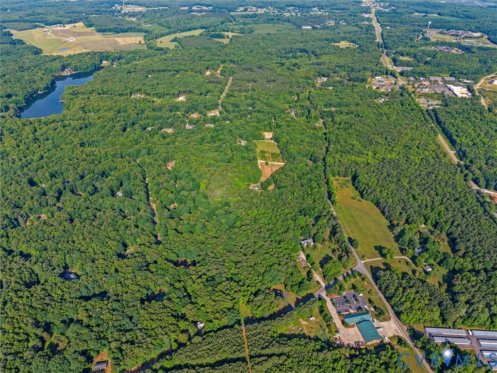 1977 Urbine Road Powhatan, VA 23139 - Photo 4 of 4 Expansive aerial showcasing a significant wooded p