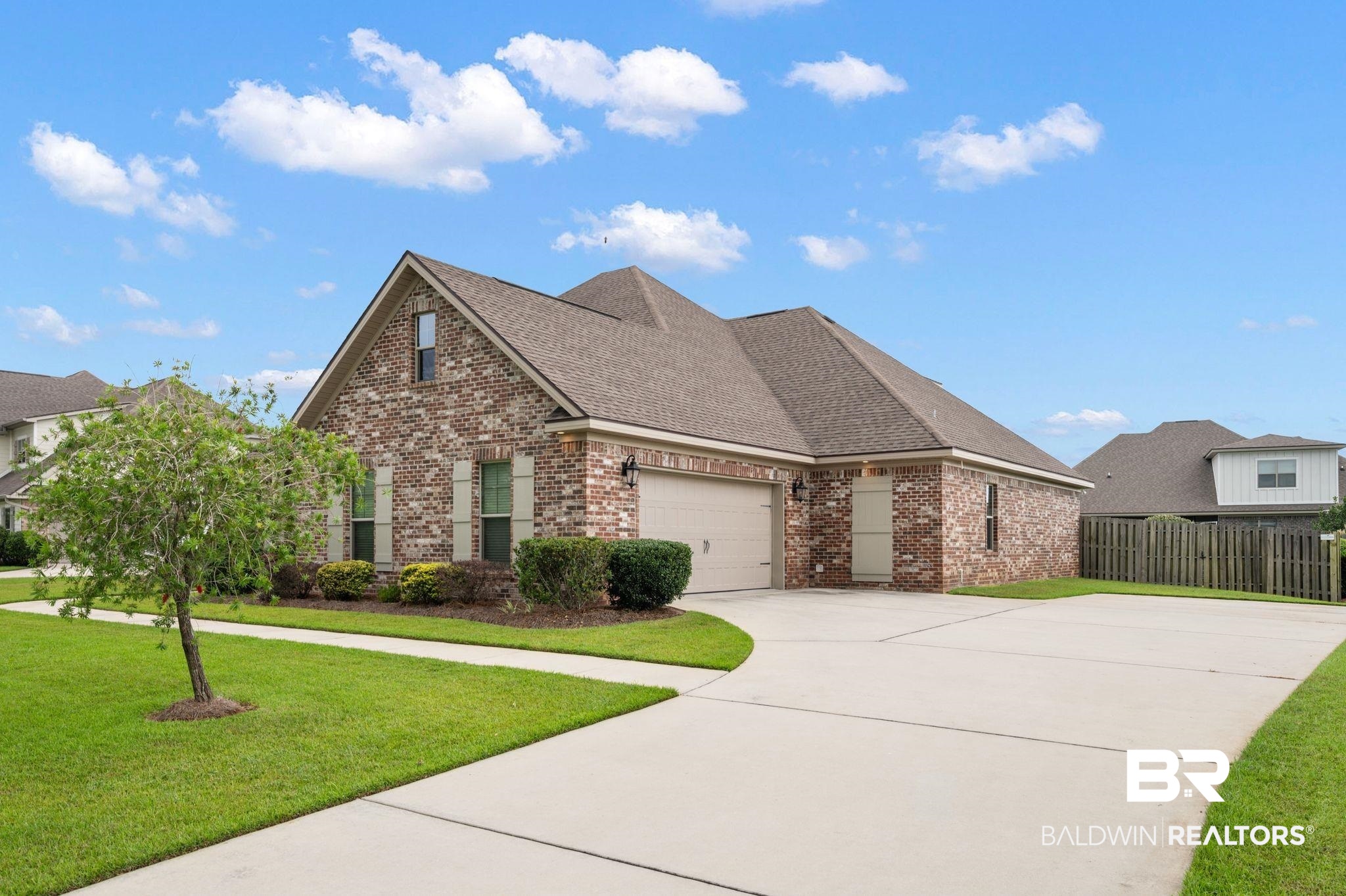 418 Fortune Drive Fairhope, AL 36532 - Photo 55 of 63 Front facade featuring a garage and a front yard