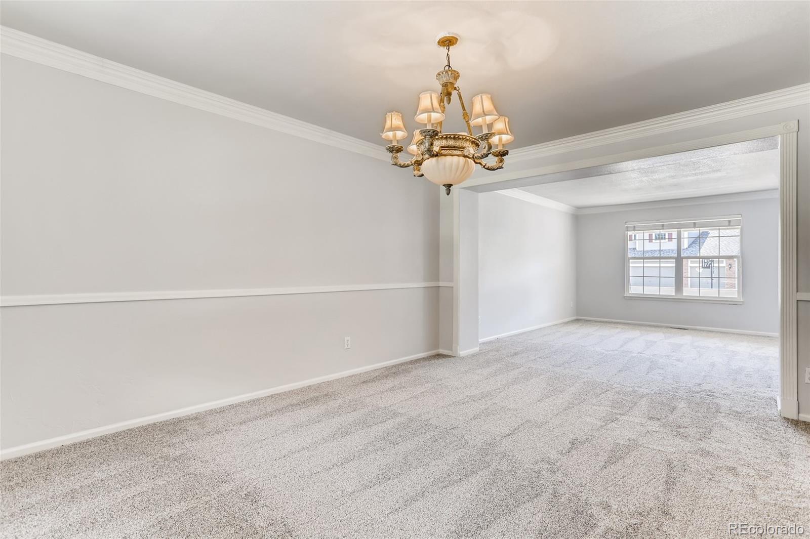 1639 Spring Water Lane Highlands Ranch, CO 80129 - Photo 11 of 39 a view of a chandelier in a room