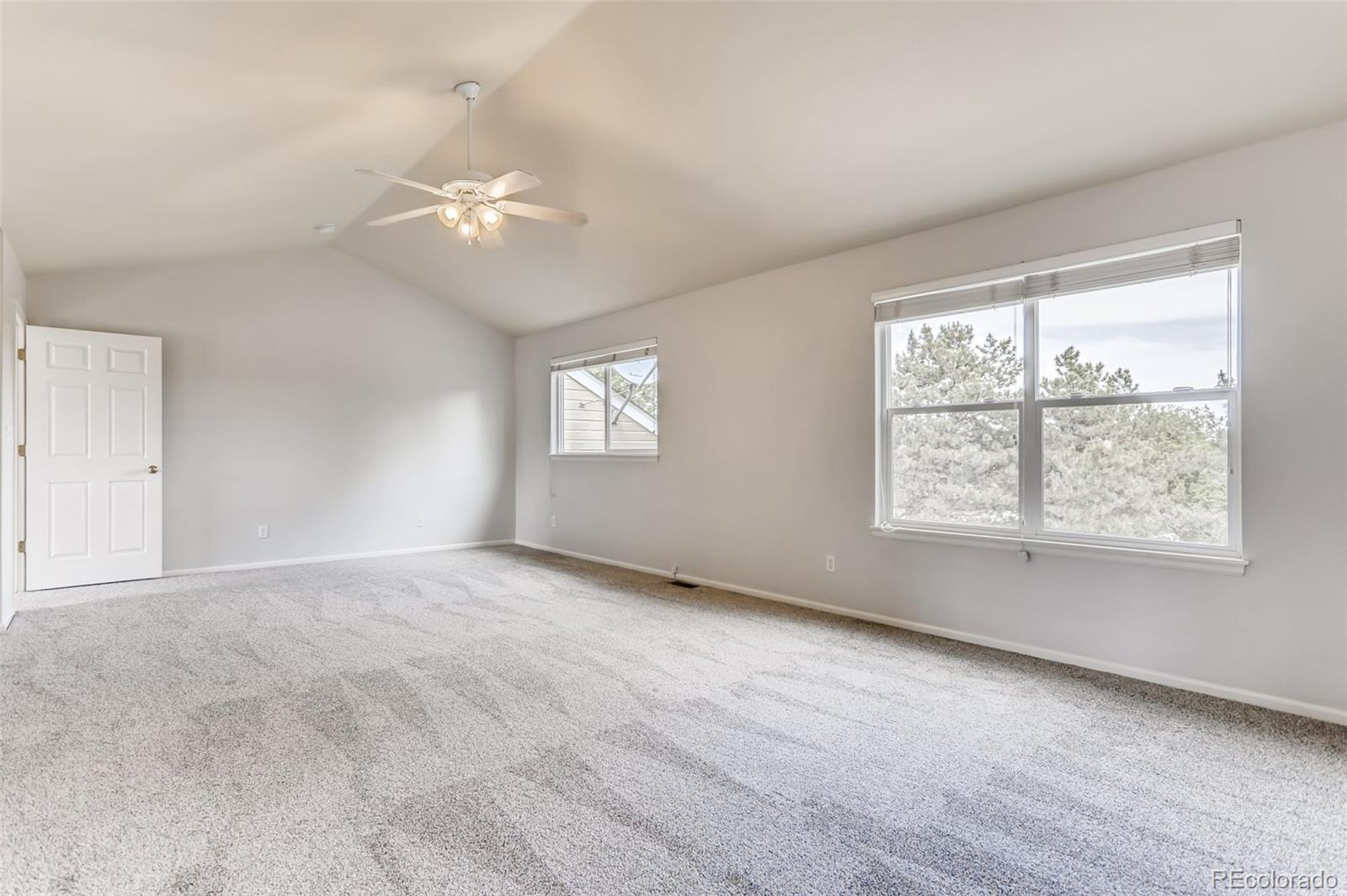 1639 Spring Water Lane Highlands Ranch, CO 80129 - Photo 25 of 39 an empty room with windows and fan