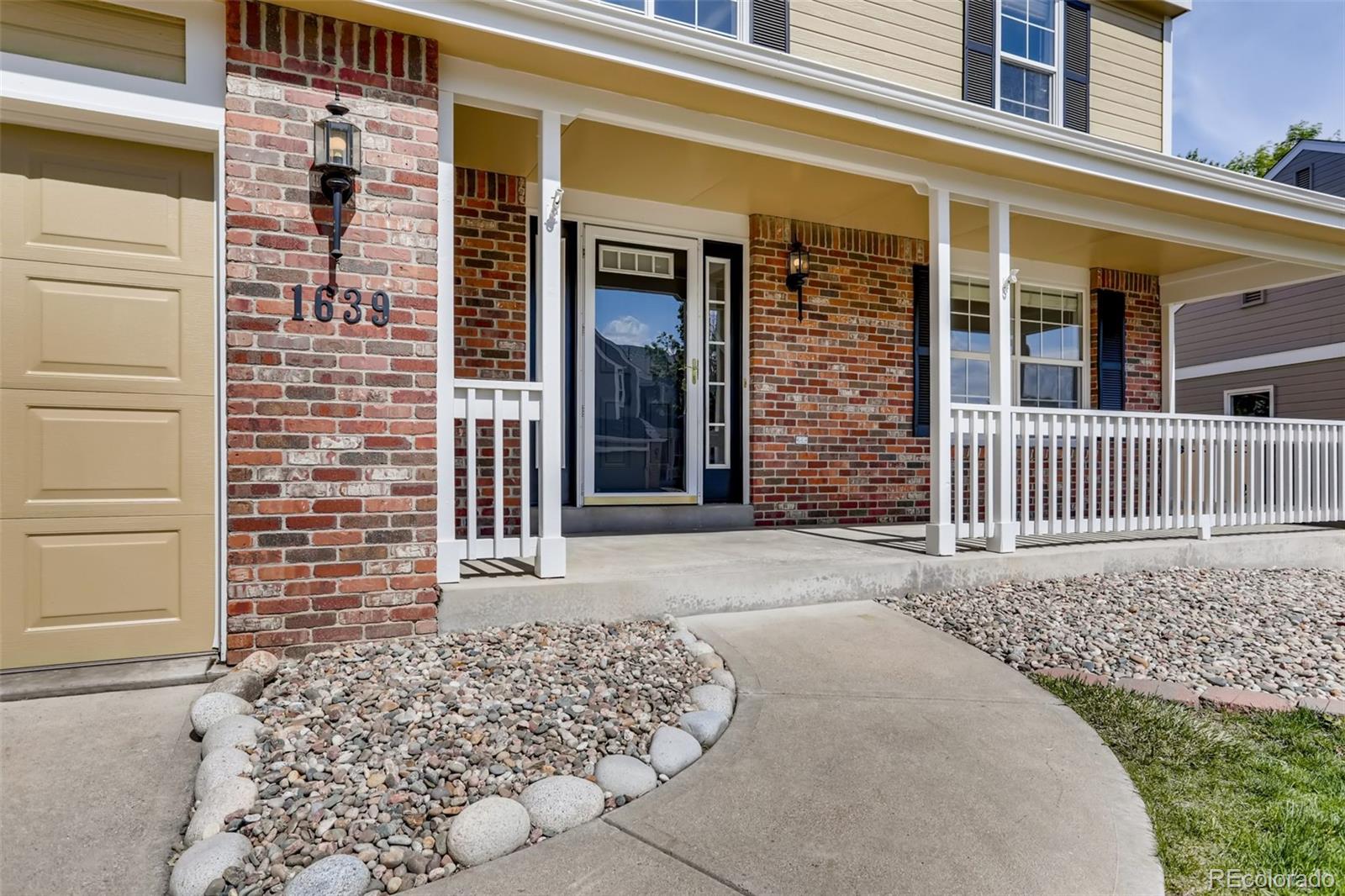 1639 Spring Water Lane Highlands Ranch, CO 80129 - Photo 3 of 39 front view of a house