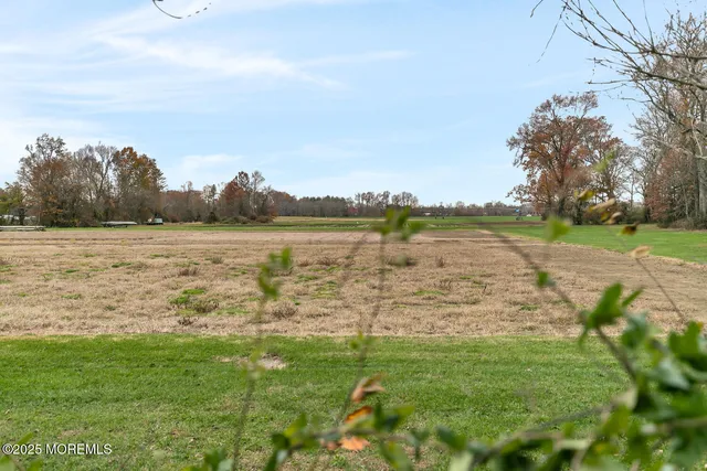 a view of a lake with houses in the back
