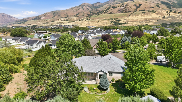 2190 750 West Perry, UT 84302 - Photo 41 of 42 Single-story residence with a gray shingle roof and a stone facade entry