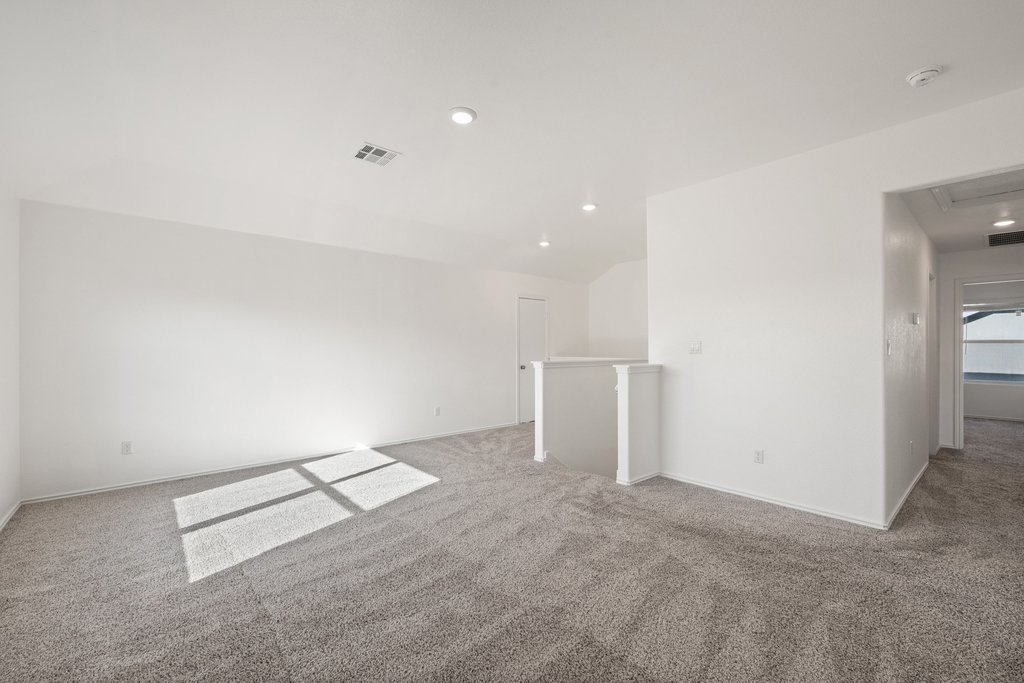 1233 Sweetspire Street Leander, TX 78641 - Photo 19 of 40 A spacious, naturally illuminated 2nd floor game room offers abundant natural light and ample room for versatile living arrangements. The second floor also offers 3 bedrooms and a full bath.